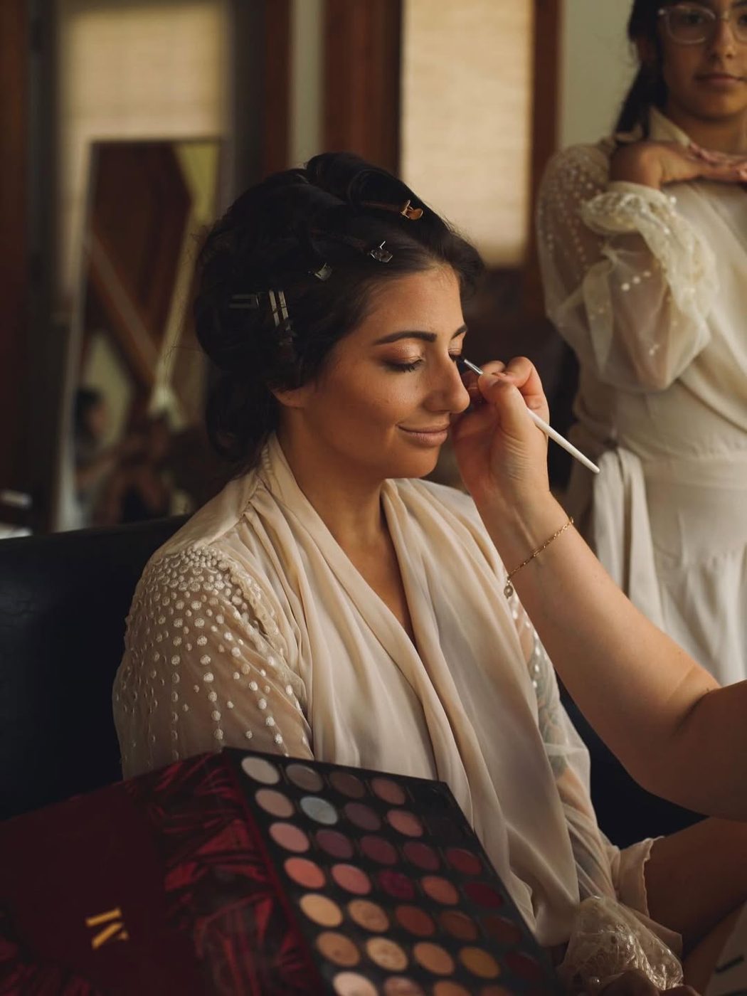 Katerina applying a bride's makeup at her trial